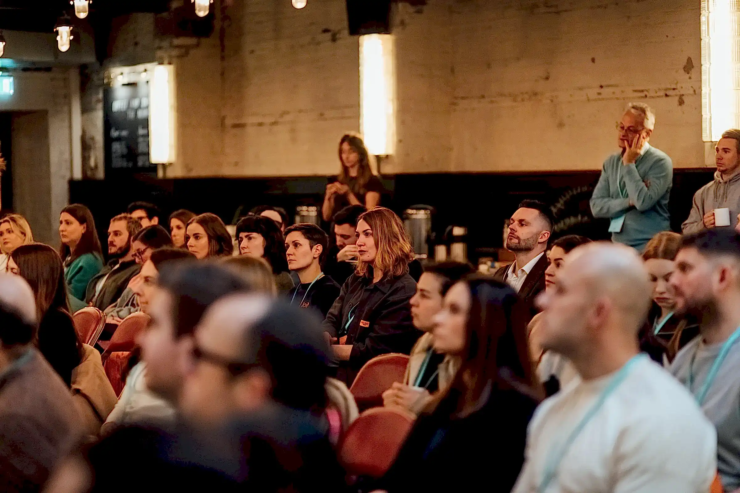 The crowd of attendees listening and taking in the Marketing for Growth presentation.