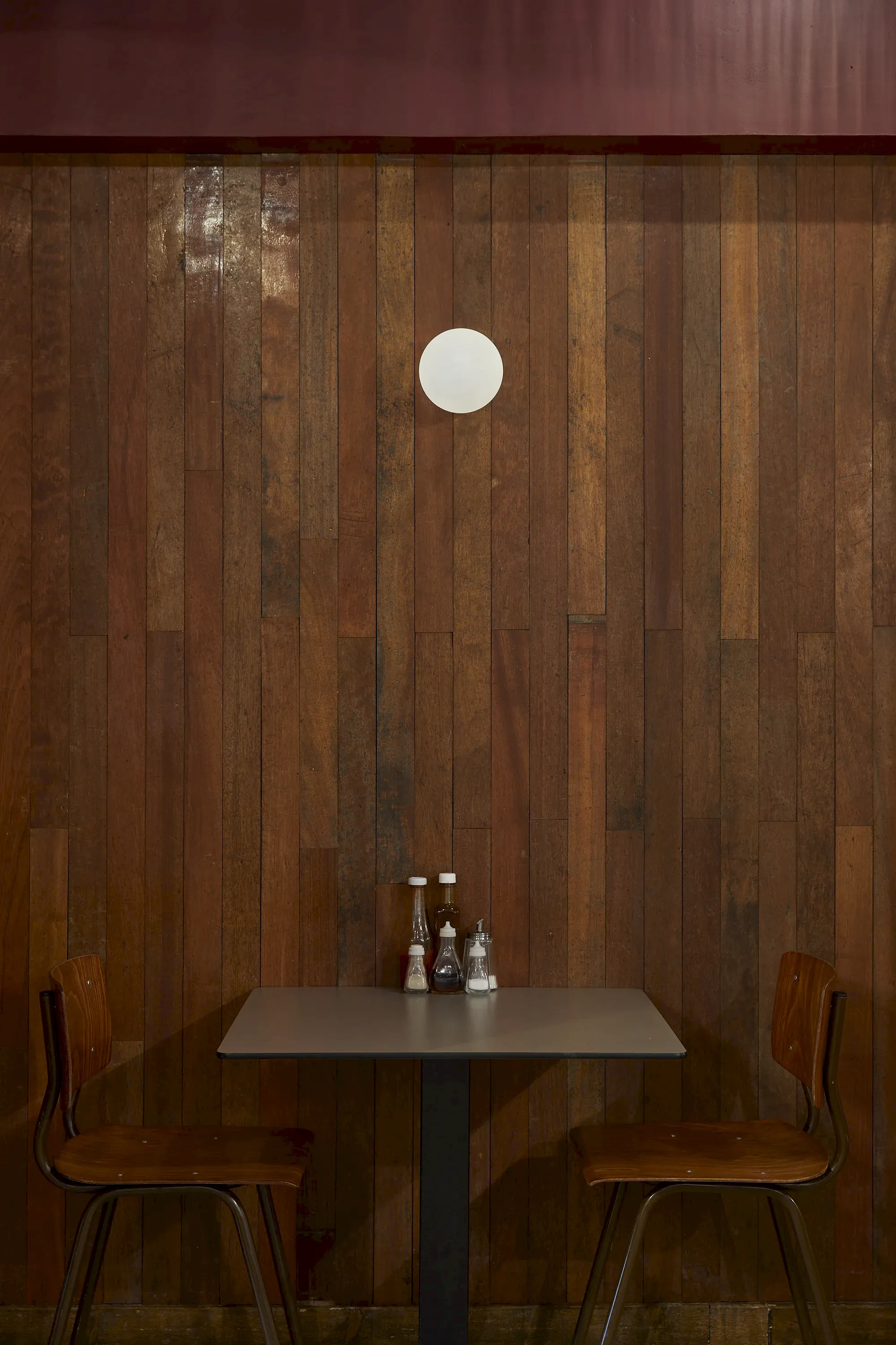 Wood cladding with table and chairs seating