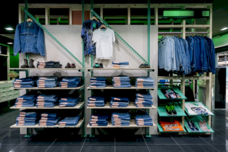 Unistrut shelving system & plywood shelves to display denim jeans & jackets in Glass Onion vintage clothing store